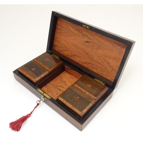 1302 - A 19thC rosewood games box, the lid decorated with playing card suits opening two reveal a fitted in... 