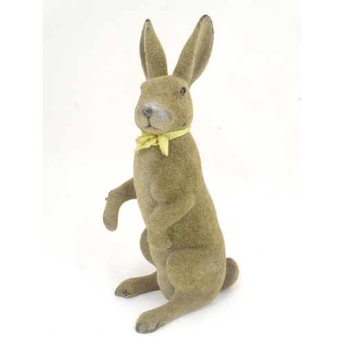 1305 - A mid 20thC model of a seated rabbit. Approximately 17