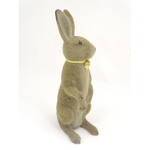 1305 - A mid 20thC model of a seated rabbit. Approximately 17