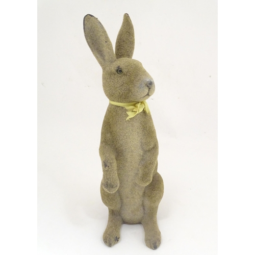 1305 - A mid 20thC model of a seated rabbit. Approximately 17