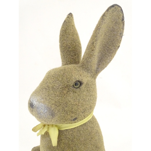 1305 - A mid 20thC model of a seated rabbit. Approximately 17