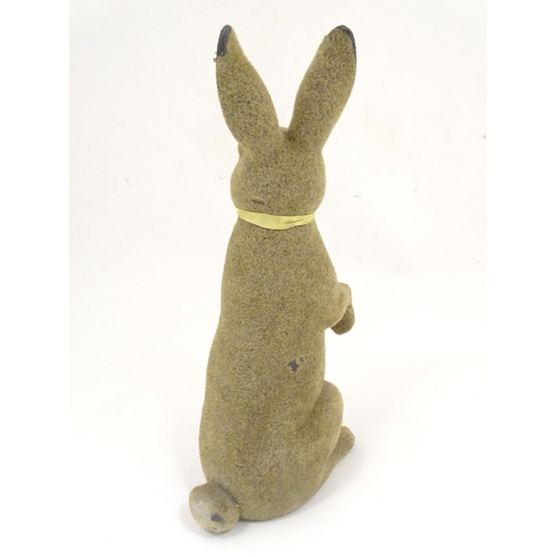 1305 - A mid 20thC model of a seated rabbit. Approximately 17