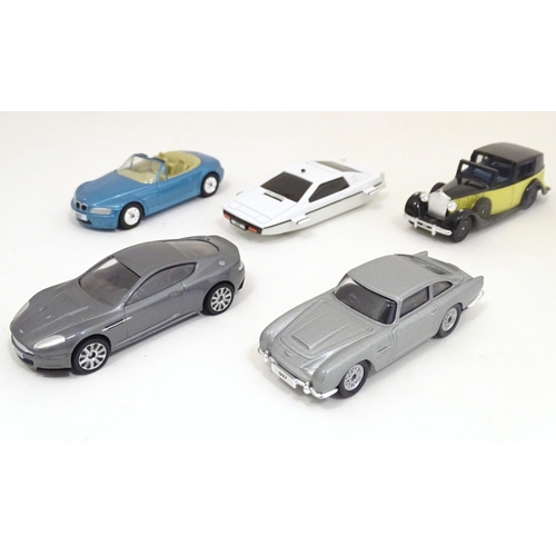 1306 - Toys: Corgi TY99135, a James Bond collectors vehicles / film canister 8 piece gift set, boxed, the c... 