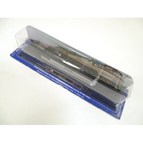 1310 - Toys: N gauge AmerCom collection model trains, comprising CP Seria 1200 1961 (Portugal), Amtrak F40P... 