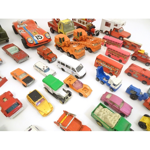 1312 - Toys: a quantity of assorted 20thC scale model cars / vehicles, the larger examples comprising a Tri... 