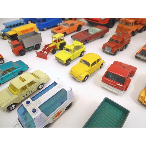 1312 - Toys: a quantity of assorted 20thC scale model cars / vehicles, the larger examples comprising a Tri... 