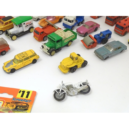 1312 - Toys: a quantity of assorted 20thC scale model cars / vehicles, the larger examples comprising a Tri... 