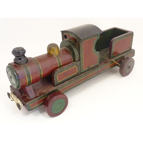 1313 - Toy: an early to mid 20thC hand made and hand painted model pull-along locomotive / train , approxim... 