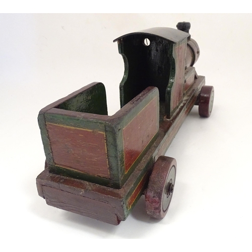 1313 - Toy: an early to mid 20thC hand made and hand painted model pull-along locomotive / train , approxim... 