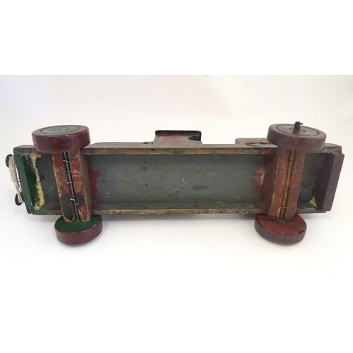 1313 - Toy: an early to mid 20thC hand made and hand painted model pull-along locomotive / train , approxim... 