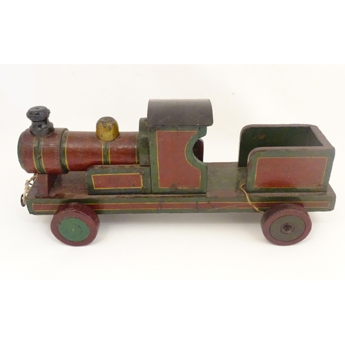 1313 - Toy: an early to mid 20thC hand made and hand painted model pull-along locomotive / train , approxim... 