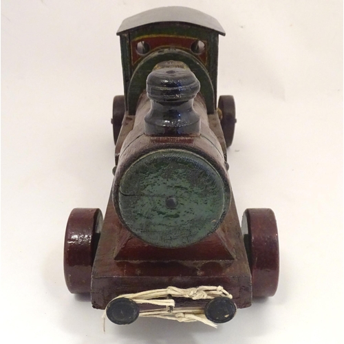 1313 - Toy: an early to mid 20thC hand made and hand painted model pull-along locomotive / train , approxim... 