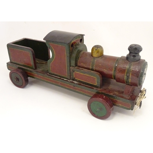 1313 - Toy: an early to mid 20thC hand made and hand painted model pull-along locomotive / train , approxim... 