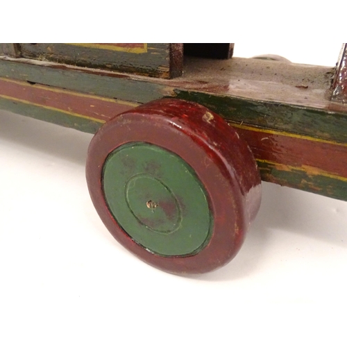 1313 - Toy: an early to mid 20thC hand made and hand painted model pull-along locomotive / train , approxim... 