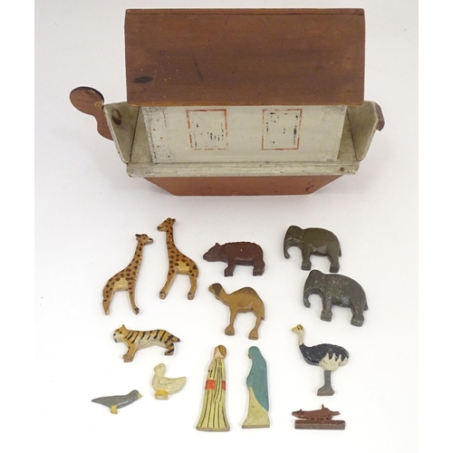 1314 - Toy: An early to mid 20thC hand made and hand painted model of Noah's Ark containing various carved ... 