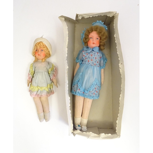 1318 - Toys: Two early to mid 20thC cloth and papier mache dolls, the largest approximately 17