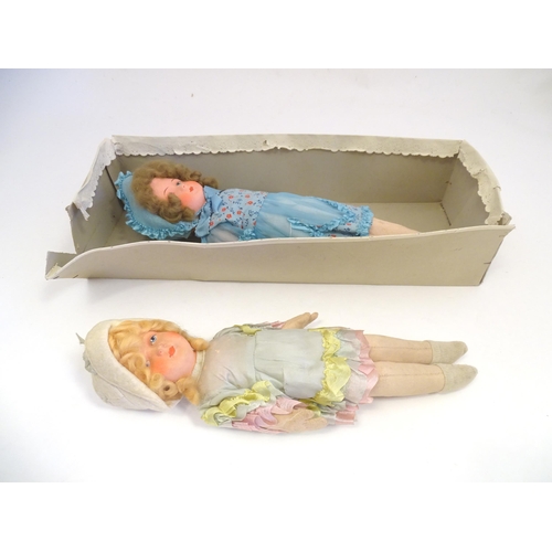 1318 - Toys: Two early to mid 20thC cloth and papier mache dolls, the largest approximately 17