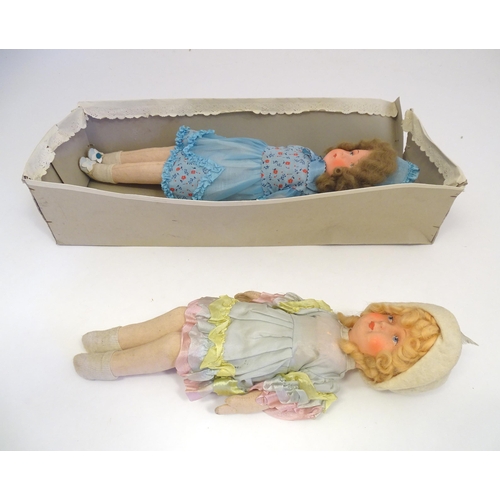 1318 - Toys: Two early to mid 20thC cloth and papier mache dolls, the largest approximately 17