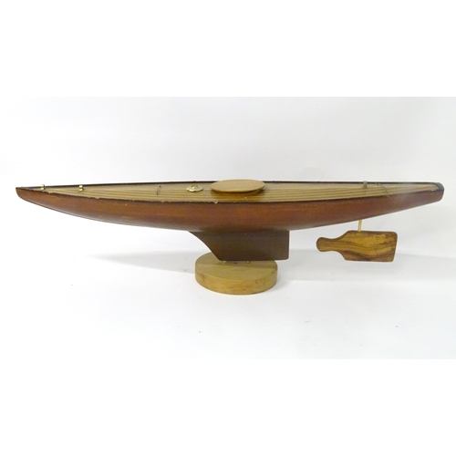 1323 - Toy: an early to mid 20thC model pond yacht / boat , carvel constructed from mahogany planks with bo... 