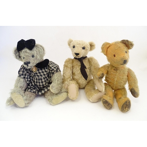 1324 - Toys: Three 20thC teddy bears with stitched noses, and articulated limbs and heads. The largest appr... 