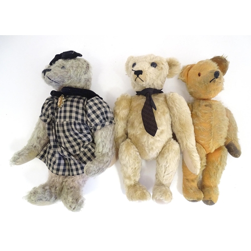 1324 - Toys: Three 20thC teddy bears with stitched noses, and articulated limbs and heads. The largest appr... 