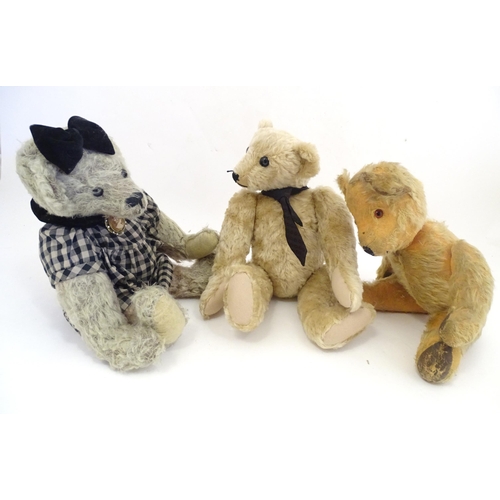 1324 - Toys: Three 20thC teddy bears with stitched noses, and articulated limbs and heads. The largest appr... 