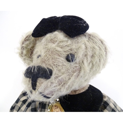 1324 - Toys: Three 20thC teddy bears with stitched noses, and articulated limbs and heads. The largest appr... 