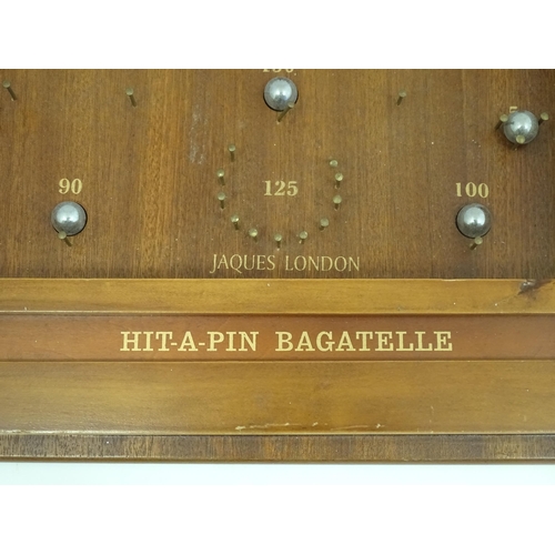 1325 - A mid to late 20thC Jacques London Hit a Pin Bagatelle pinball board. Approx. 30 1/2