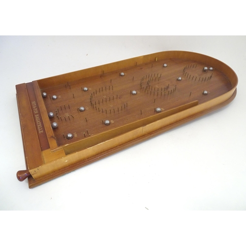 1325 - A mid to late 20thC Jacques London Hit a Pin Bagatelle pinball board. Approx. 30 1/2