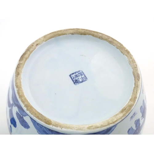 13 - An Oriental blue and white ginger jar decorated with a landscape scene with a dragon dance processio... 