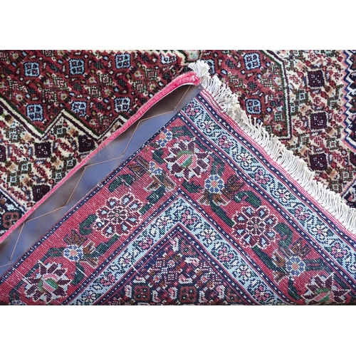 1377 - Carpet / Rug : A Senneh Rug, the red, purple and cream ground with central medallion and with geomet... 