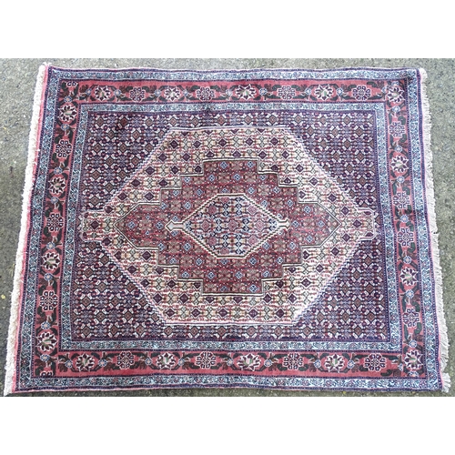 1377 - Carpet / Rug : A Senneh Rug, the red, purple and cream ground with central medallion and with geomet... 