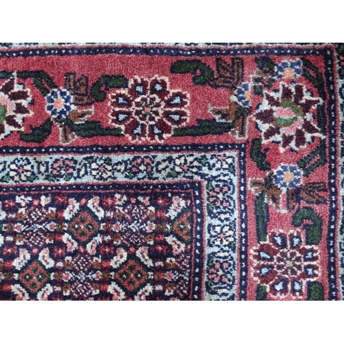 1377 - Carpet / Rug : A Senneh Rug, the red, purple and cream ground with central medallion and with geomet... 