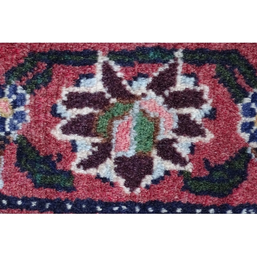 1377 - Carpet / Rug : A Senneh Rug, the red, purple and cream ground with central medallion and with geomet... 