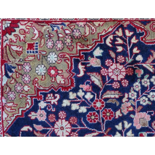 1379 - Carpet / Rug : A Sarouk rug, the red and blue grounds with central medallion and floral and foliate ... 