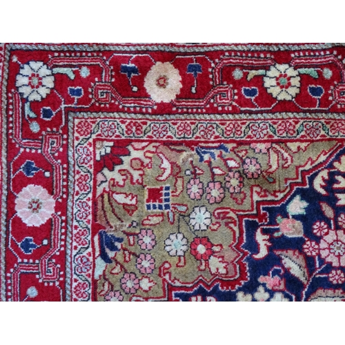 1379 - Carpet / Rug : A Sarouk rug, the red and blue grounds with central medallion and floral and foliate ... 