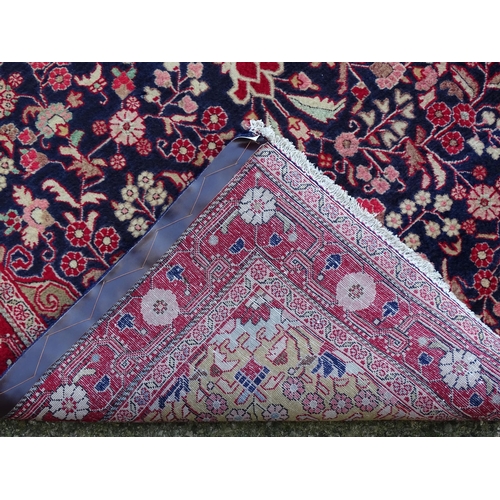 1379 - Carpet / Rug : A Sarouk rug, the red and blue grounds with central medallion and floral and foliate ... 