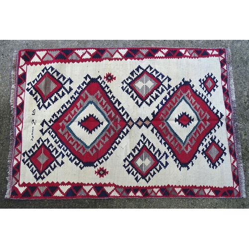 1380 - Carpet / Rug : A Qashqai kilim, the cream ground with red, blue and grey geometric decoration. Appro... 