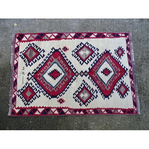 1380 - Carpet / Rug : A Qashqai kilim, the cream ground with red, blue and grey geometric decoration. Appro... 