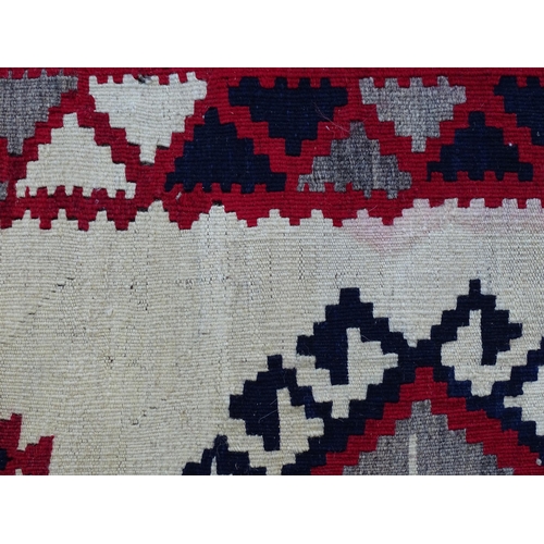 1380 - Carpet / Rug : A Qashqai kilim, the cream ground with red, blue and grey geometric decoration. Appro... 