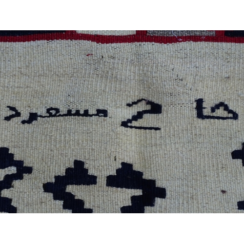 1380 - Carpet / Rug : A Qashqai kilim, the cream ground with red, blue and grey geometric decoration. Appro... 