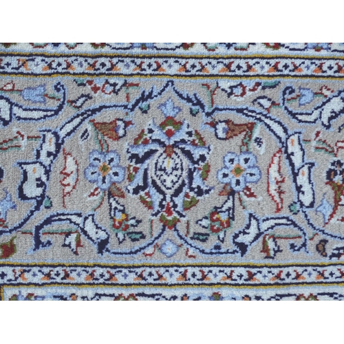 1382 - Carpet / Rug : A Kashan carpet, the cream and beige ground with central medallion and floral and fol... 