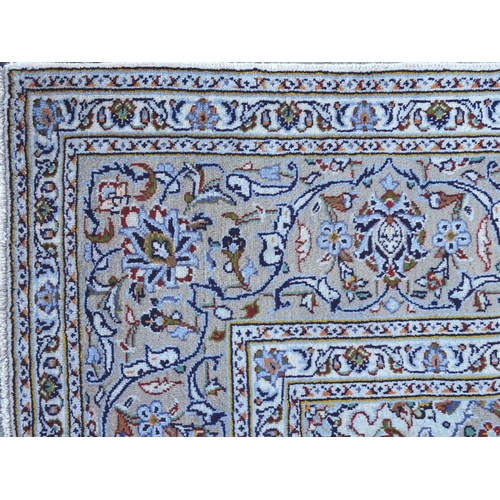 1382 - Carpet / Rug : A Kashan carpet, the cream and beige ground with central medallion and floral and fol... 