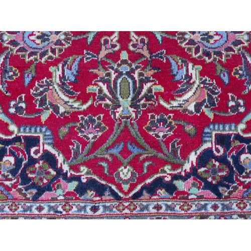 1384 - Carpet / Rug : A Kashan carpet, the red, blue and cream ground with central medallion and floral and... 