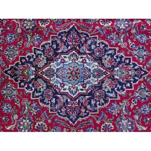 1384 - Carpet / Rug : A Kashan carpet, the red, blue and cream ground with central medallion and floral and... 