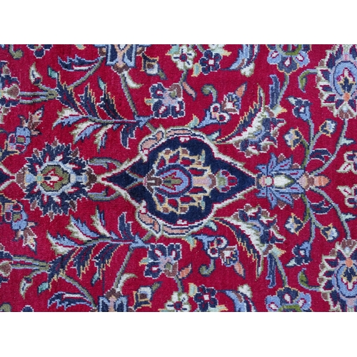 1384 - Carpet / Rug : A Kashan carpet, the red, blue and cream ground with central medallion and floral and... 