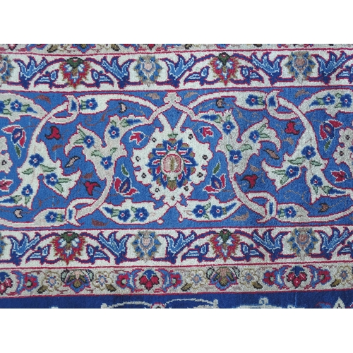 1385 - Carpet / Rug : An Isfahan carpet,  the blue ground with central medallion and floral and foliate det... 