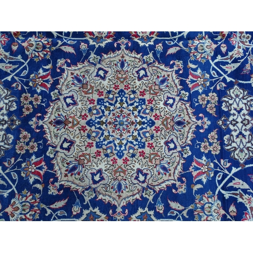 1385 - Carpet / Rug : An Isfahan carpet,  the blue ground with central medallion and floral and foliate det... 