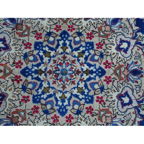 1385 - Carpet / Rug : An Isfahan carpet,  the blue ground with central medallion and floral and foliate det... 