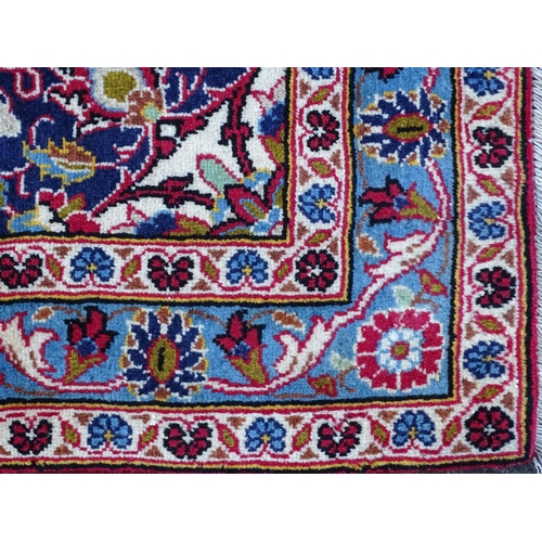 1386 - Carpet / Rug: A Kashan runner, the red ground with three central medallions bordered by foliate deta... 